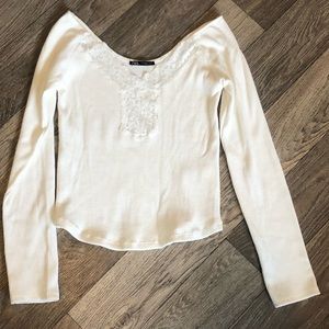 Zara white long sleeve blouse with lace detail.
